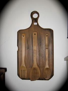 Handmade wooden primitive utensil holder and utensils.